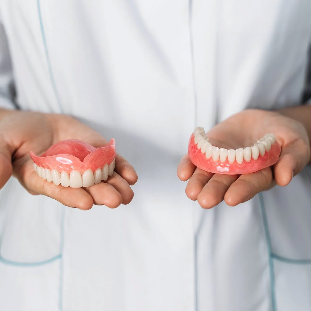 dentist_holding_dentures